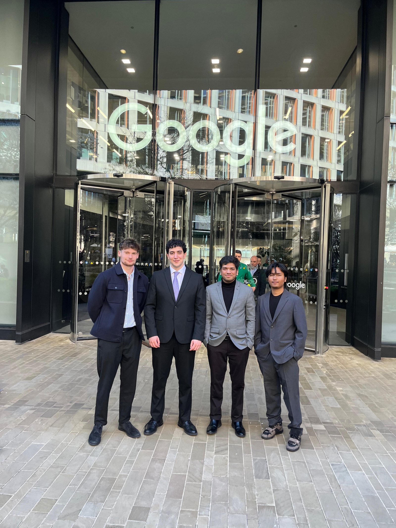 The four members of the Invixa team together outside a building